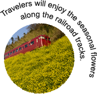 Travelers will enjoy the seasonal flowers along the railroad tracks.